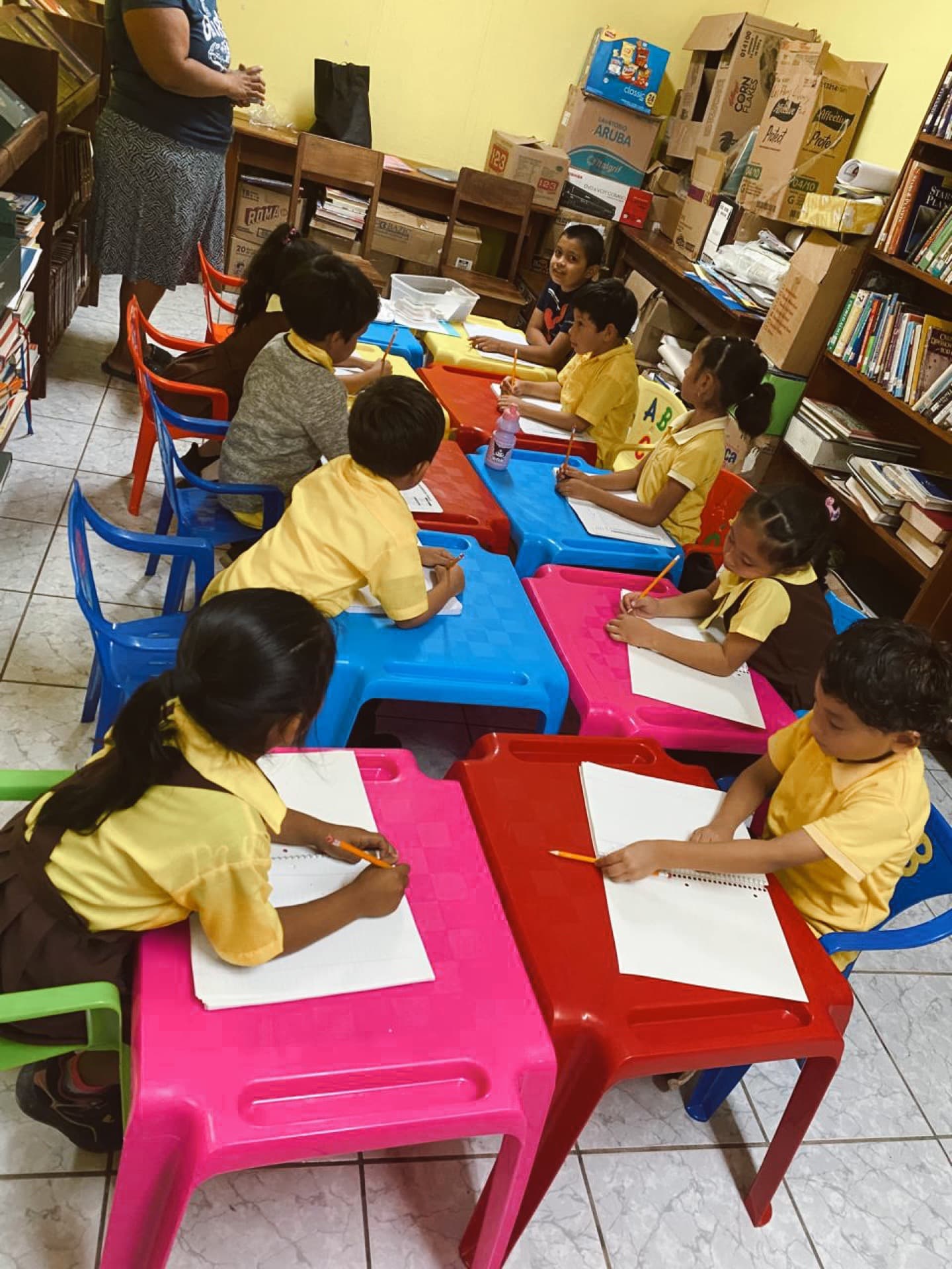 Kids at colorful tables during afterschool study time