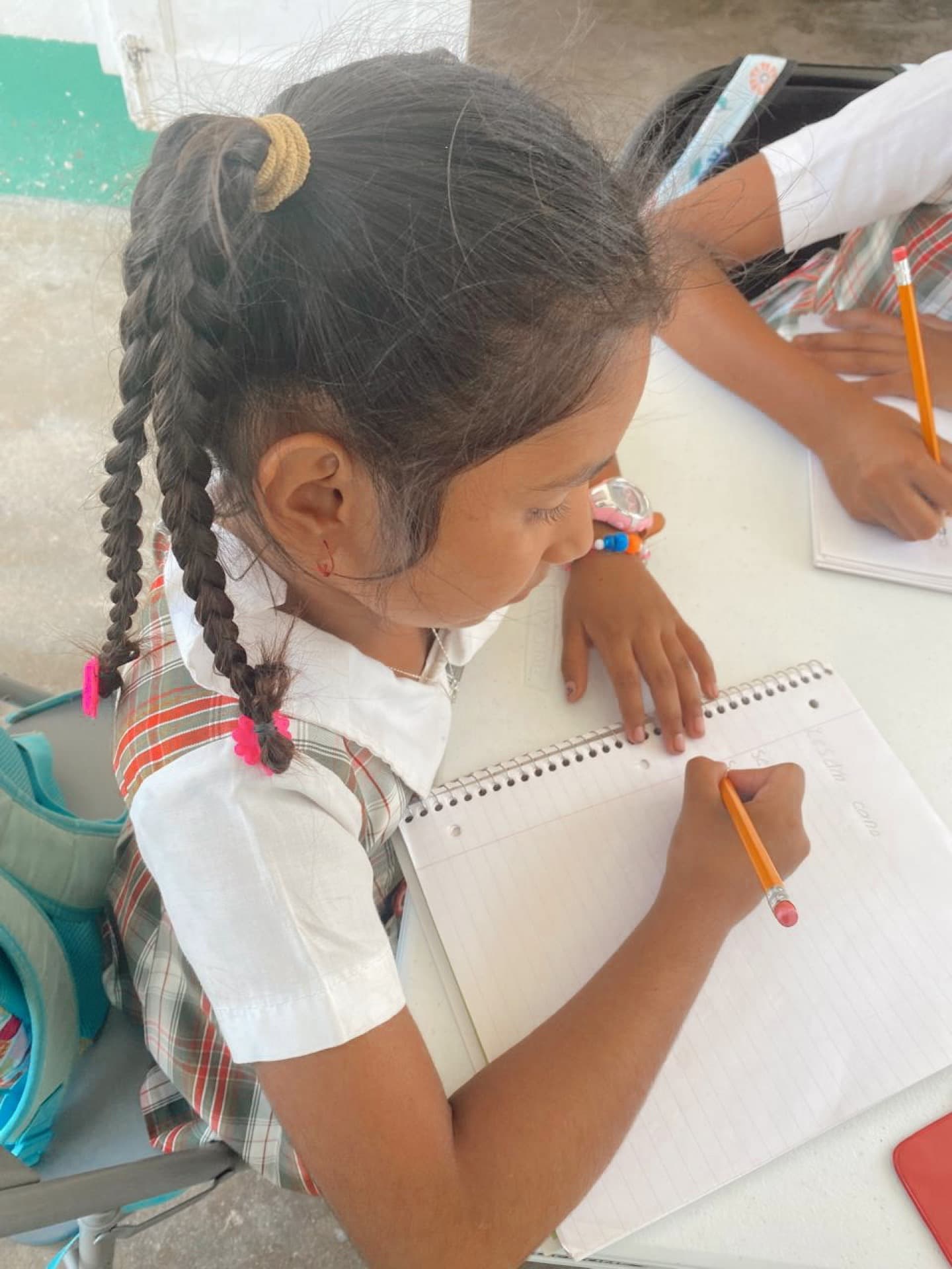A child working on schoolwork at the afterschool program